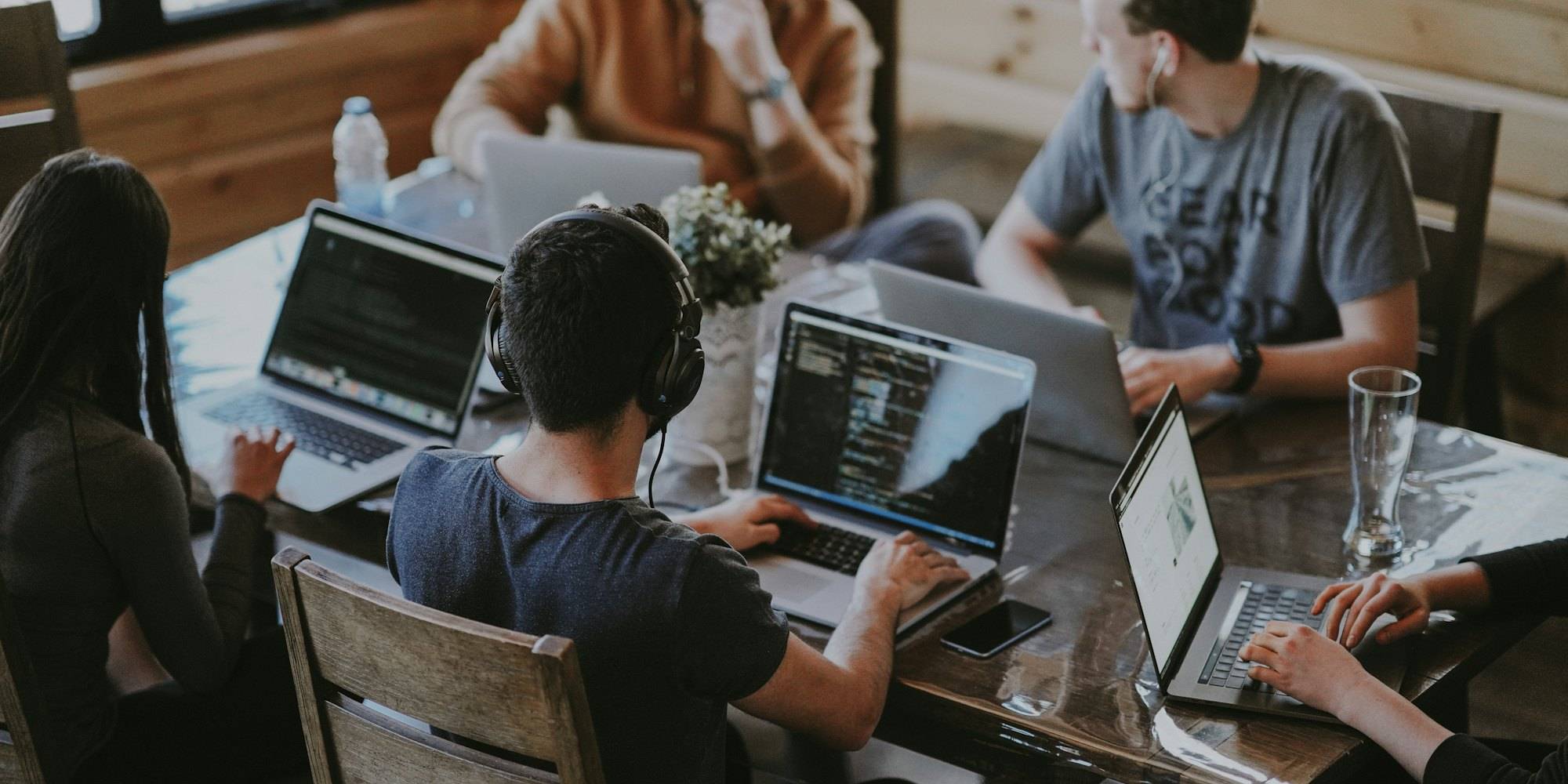 A software team working together at laptops